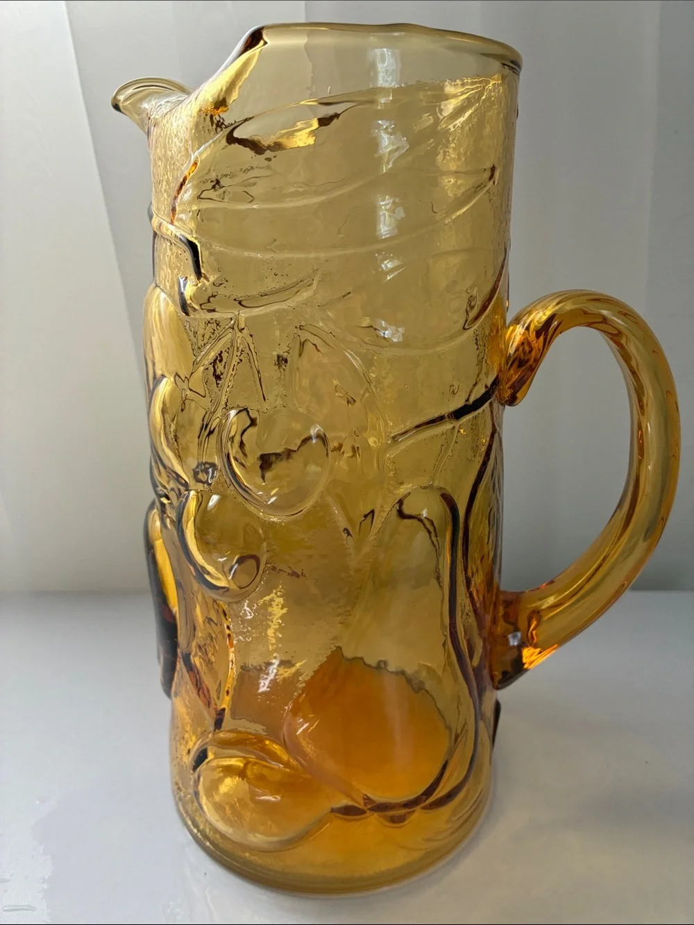 Amber Pressed Glass Pitcher with Fruit Motif